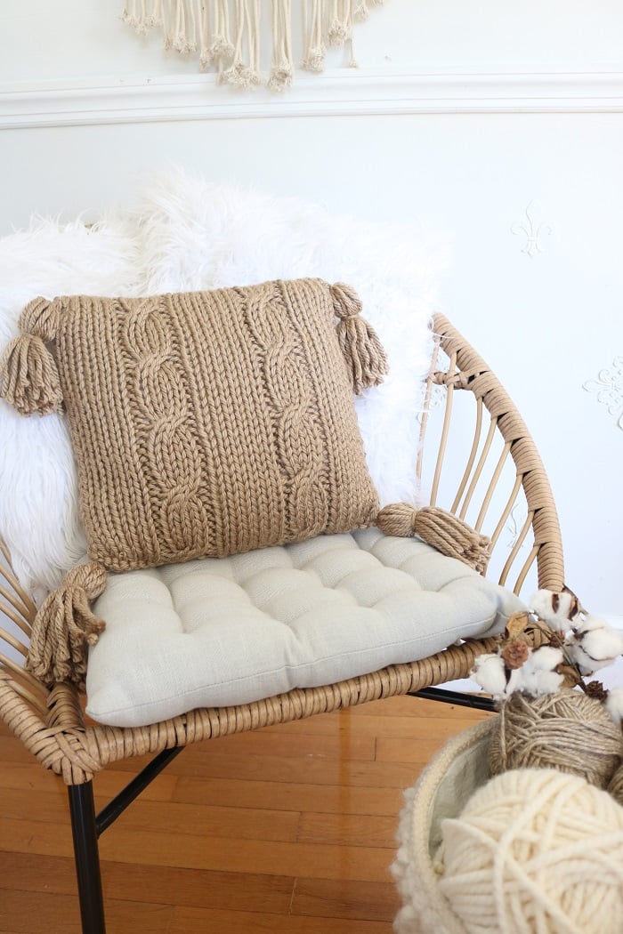 Cable Pillow Cover Knit Pattern - on chair with tufted pillow, 2 faux fur pillow, closer
