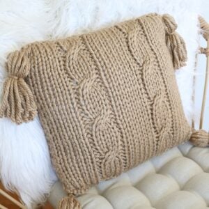 Cable Pillow Cover Knit Pattern - on chair with tufted pillow, 2 faux fur pillow, closeup 2