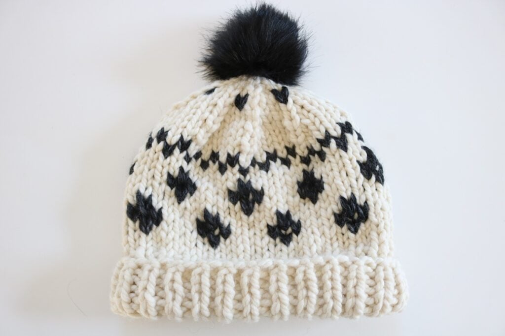 Black and Cream Fair Isle Hat Knit Pattern - finished hat with rolled brim and pom pom