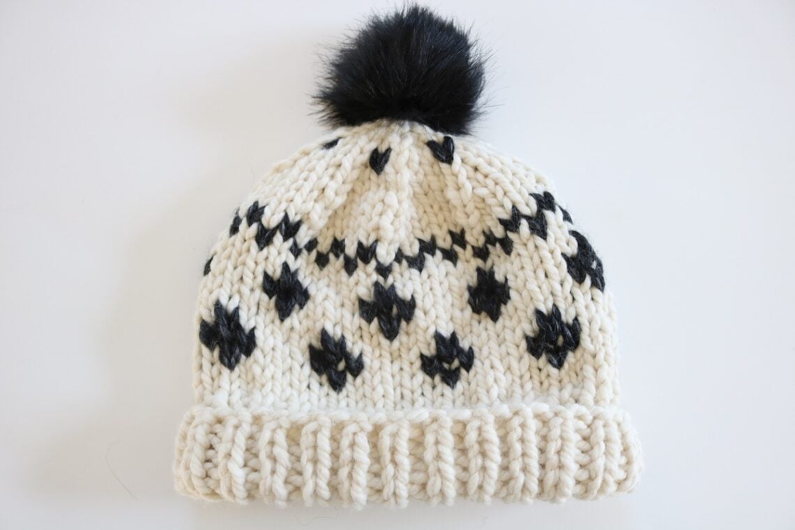 Black and Cream Fair Isle Hat Knit Pattern - finished hat with rolled brim and pom pom