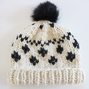 Black and Cream Fair Isle Hat Knit Pattern - finished hat with rolled brim and pom pom