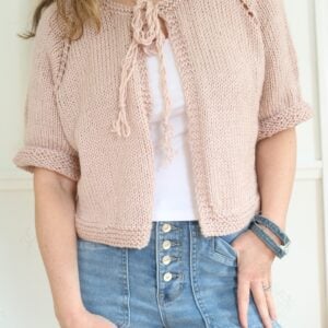 woman wearing pink knit cardigan