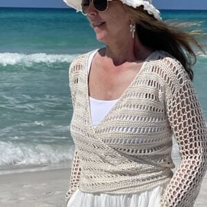 woman wearing crochet wrap top on beach