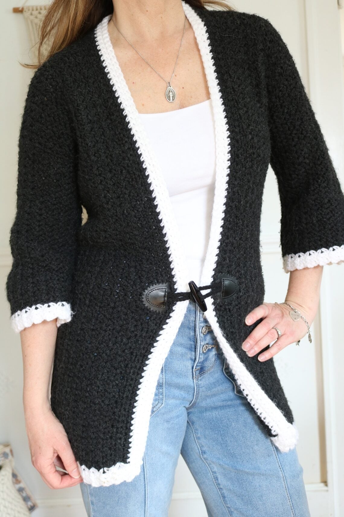 woman wearing long crochet cardigan