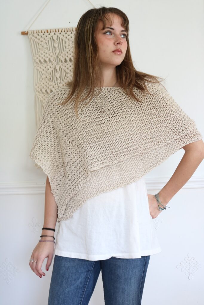 woman wearing knit cotton poncho 