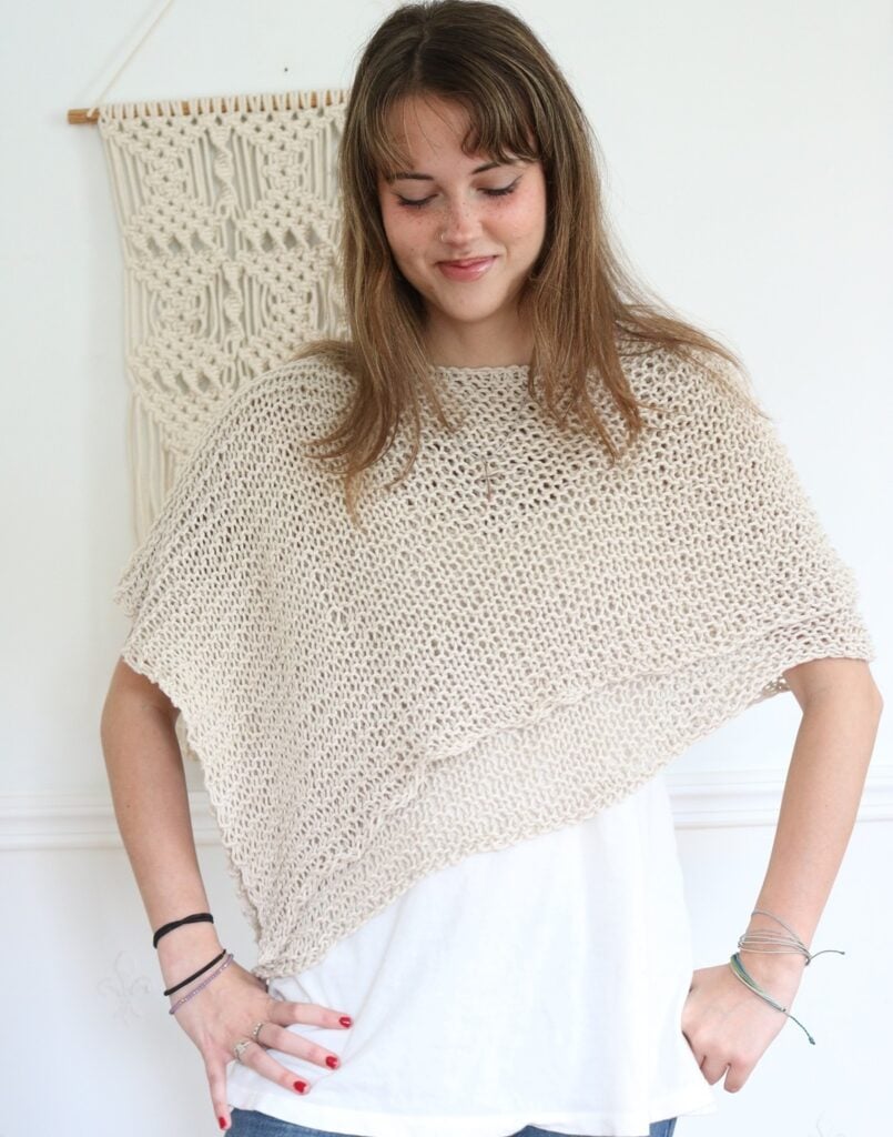 woman wearing knit cotton poncho for summer