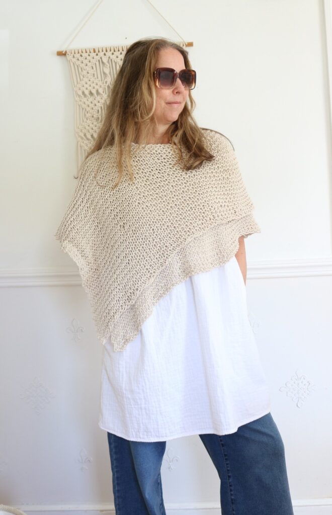 woman wearing knit cotton poncho 