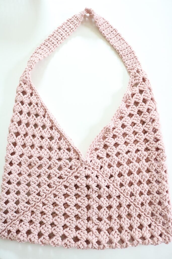 granny square crochet bag on table