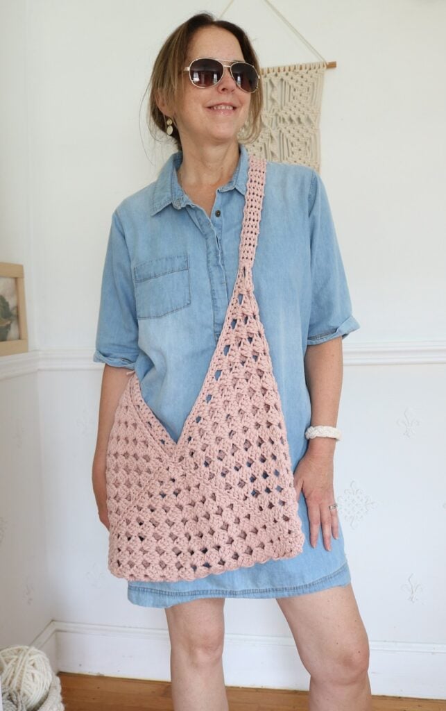 woman wearing granny square crochet bag
