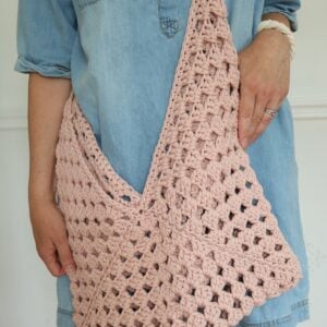 woman wearing granny square crochet bag