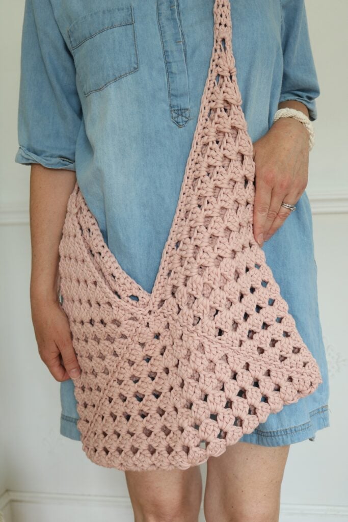 woman wearing granny square crochet bag