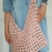 woman wearing granny square crochet bag