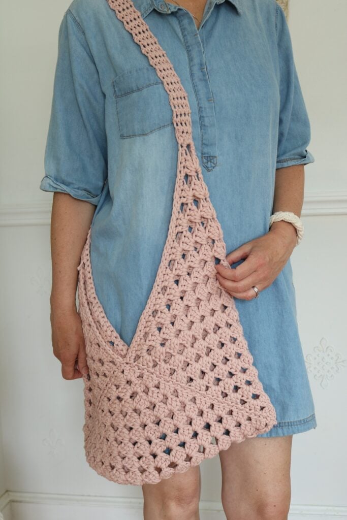 woman wearing granny square crochet bag