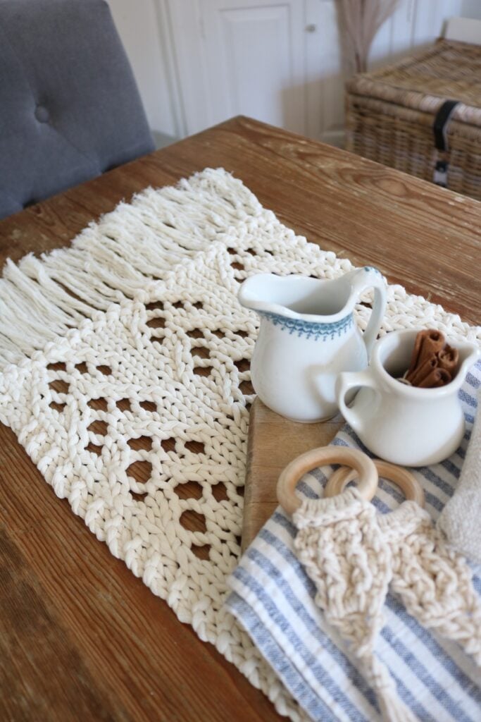 knit table runner on table with props