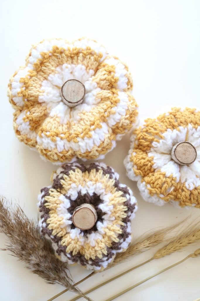 Crochet Striped Pumpkins, flatlay with wheat 3 1200px