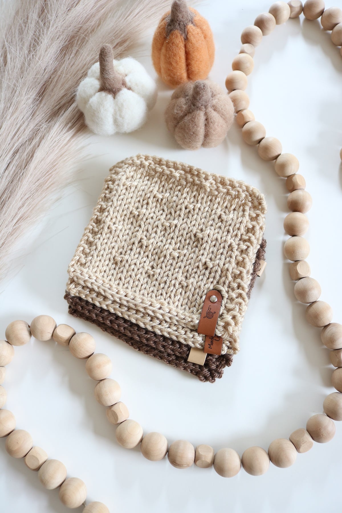 Textured Coasters Knit Pattern - flatlay, worsted yarn, with pampass and props